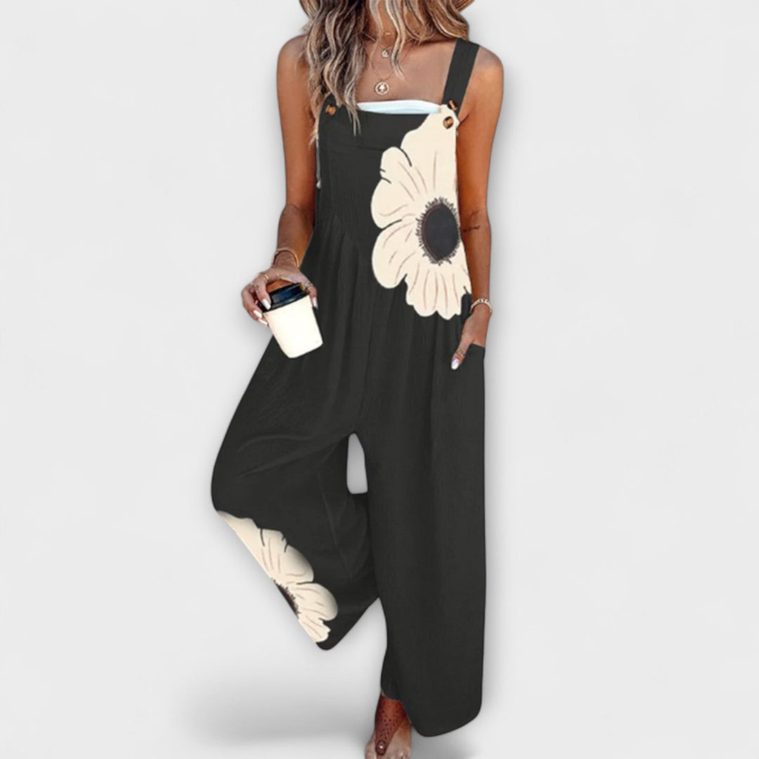 Clémentine - Schwarze Latzhose mit grosen Blumenmotiven
